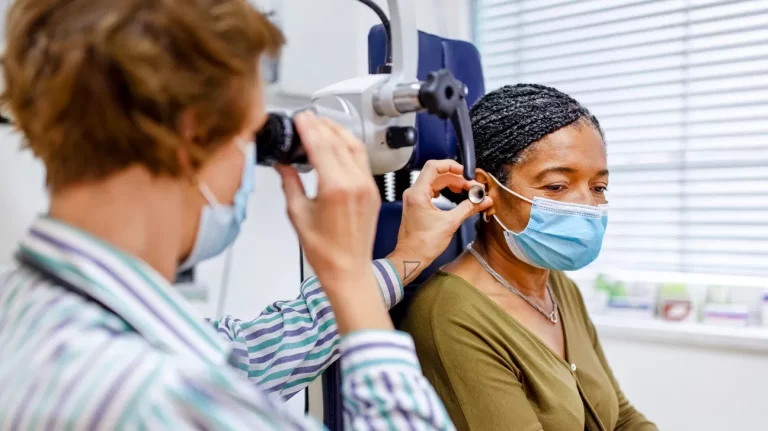 ENT doctor examining a patient’s ear